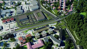 Eine 3D-Visualisierung der Maßnahme als Luftbild. Ein neuer Kreisverkehr, die Unterführung unter der Bahn und eine breite Grünbrücke mit Fuß- und Radwegen sind erkennbar. 