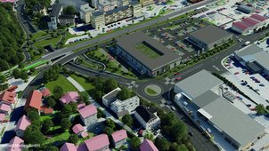 Eine 3D-Visualisierung der Maßnahme als Luftbild. Ein neuer Kreisverkehr, die Unterführung unter der Bahn und eine breite Grünbrücke mit Fuß- und Radwegen sind erkennbar. 