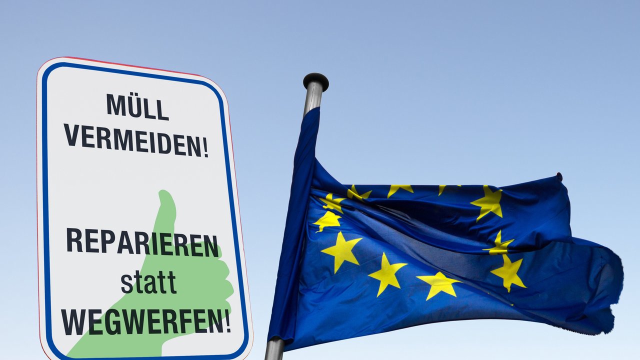 Man sieht ein Schild mit der Aufschrift " Müll vermeiden ... Reparieren statt wegwerfen" und eine Europafahne